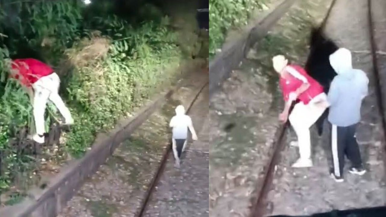 Alsancak'ta raylara çıkan iki kişi hareket halindeki trenin önünü kesti, taş attılar